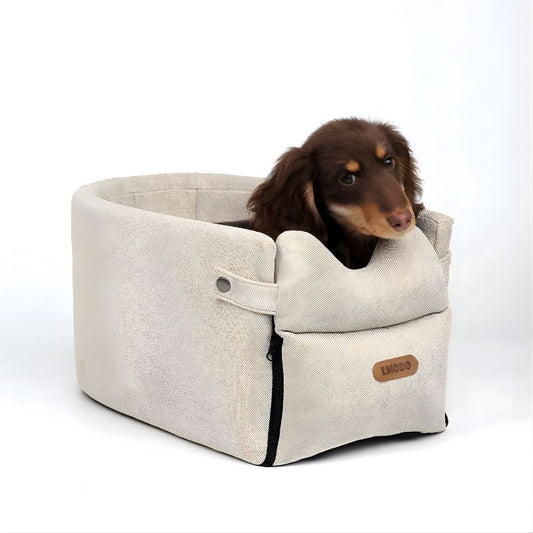 Dog peeking out from a beige pet carrier on a white background