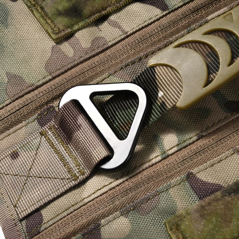 Metal D-ring on a camouflage fabric background