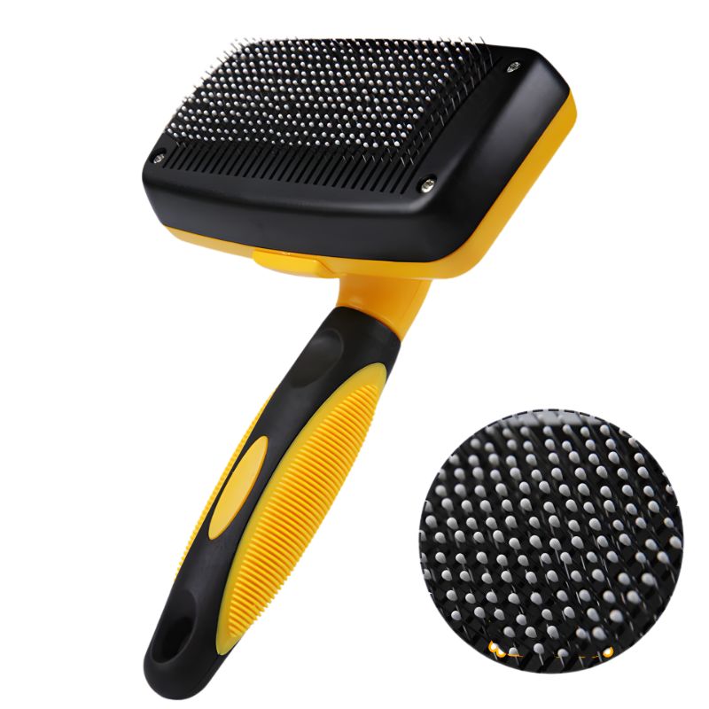 Yellow and black pet grooming brush with close-up of bristle detail on a white background