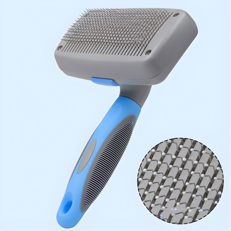 Pet grooming brush with blue handle and gray bristles on a light blue background