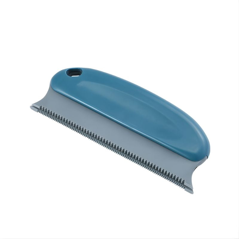 Blue pet grooming brush on a white background